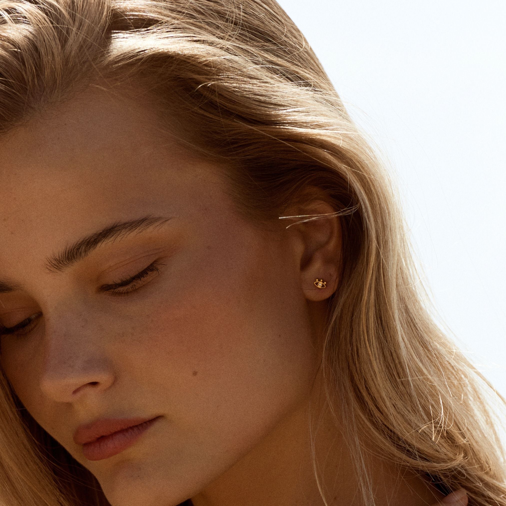 gold-evil-eye-stud-earrings.jpg